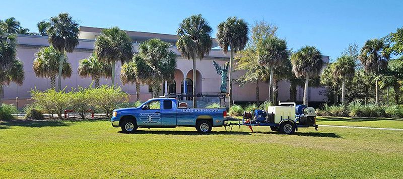 One of Professional Plumbing  Design's trucks parked in front of The Ringling in Sarasota, Florida