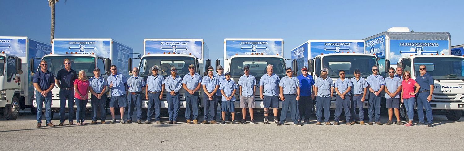 The Professional Plumbing & Design team with the Ringling Causeway and Sarasota Bay in the background.